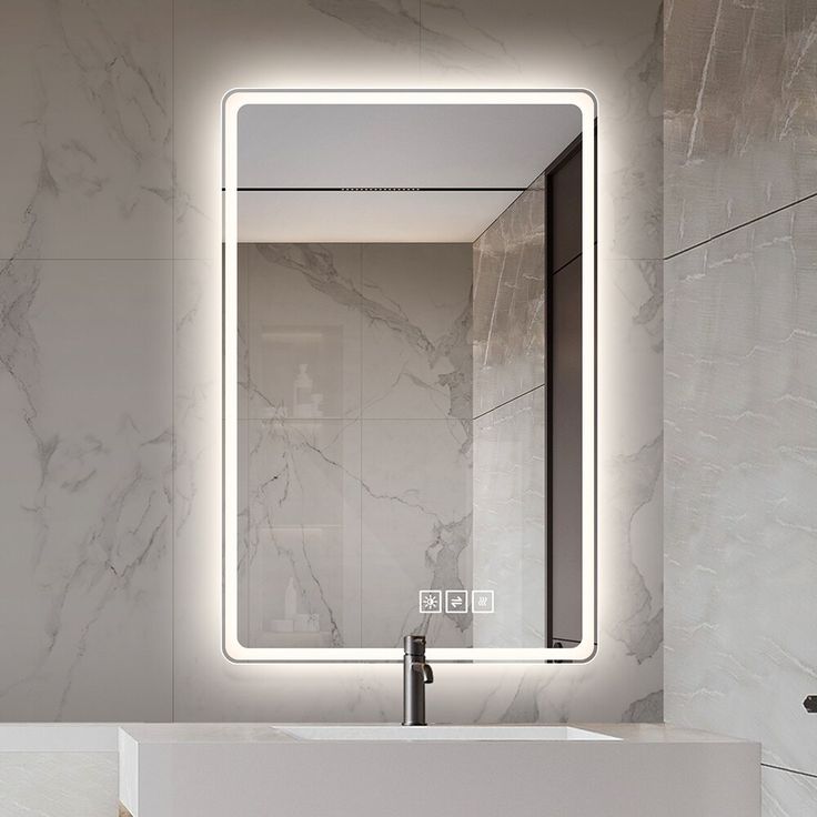 Bathroom mirror with LED lighting on a marble wall
