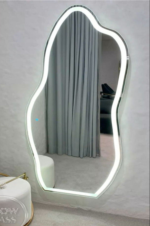 Modern LED mirror with a light frame on a white wall.