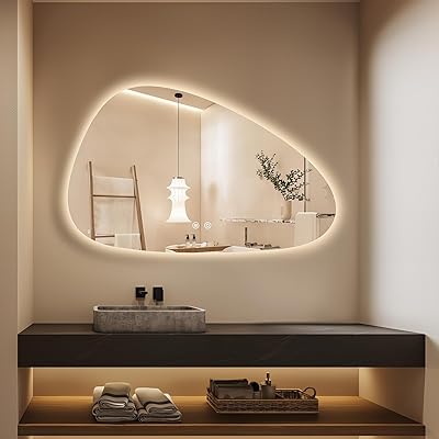 Modern bathroom with a large illuminated mirror and sink vanity.